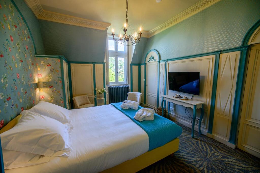 Postel nebo postele na pokoji v ubytování Château Origny - Moulins