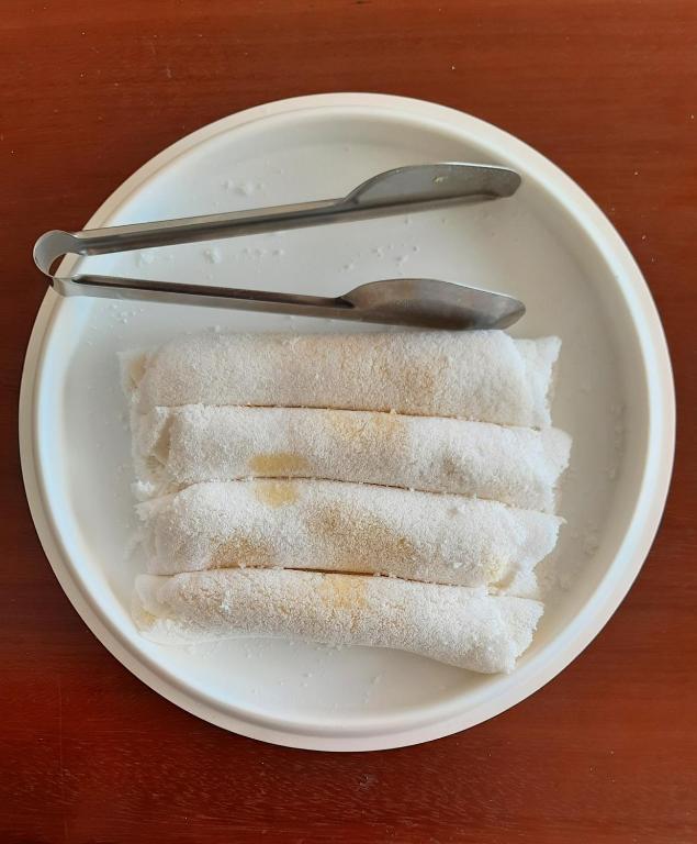 a white plate with some food on a table at Pousada Brilho dos Lençóis in Barreirinhas