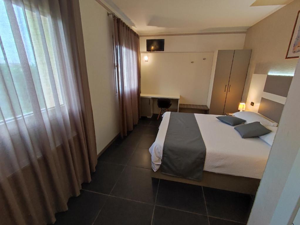 A bed or beds in a room at Therra Lodge