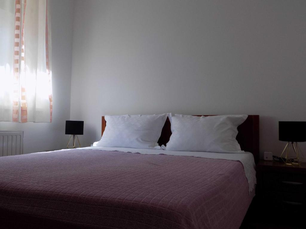 Postel nebo postele na pokoji v ubytování Apartman Borna