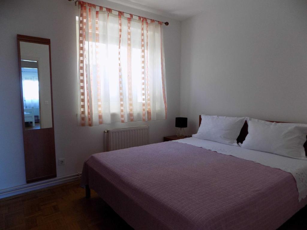 Postel nebo postele na pokoji v ubytování Apartman Borna