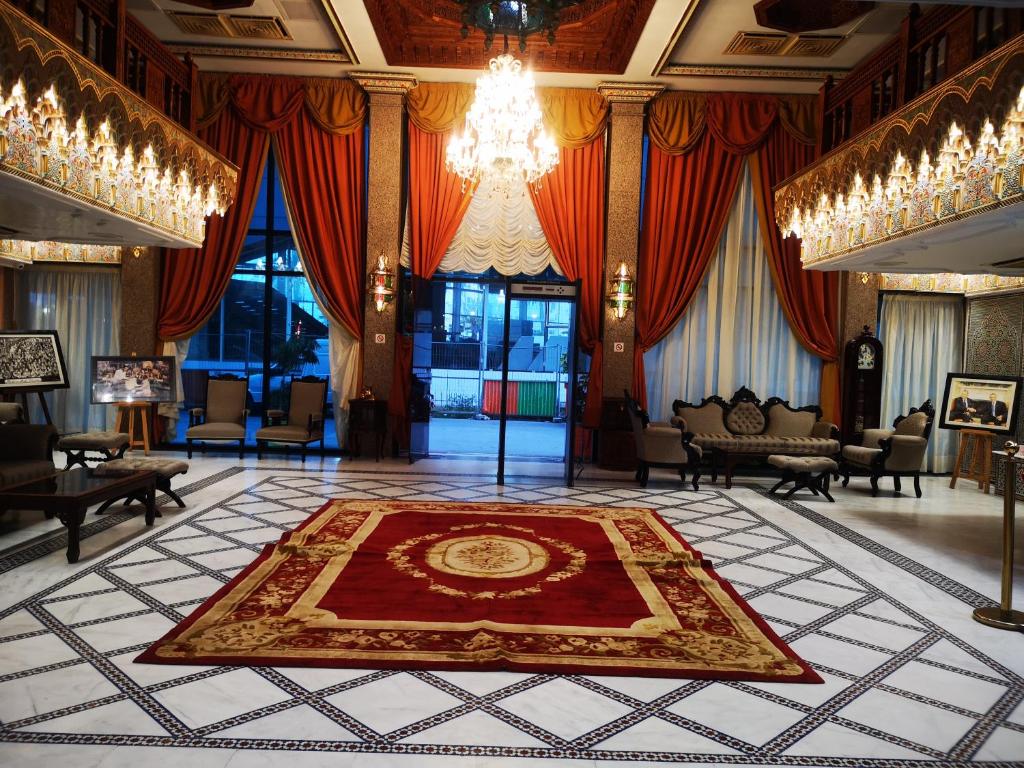 a large room with a large rug on the floor at Majliss Hotel Downtown in Rabat