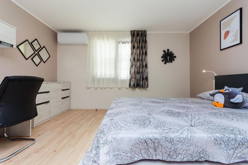 Postel nebo postele na pokoji v ubytování Apartment Slavko