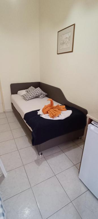 Łóżko lub łóżka w pokoju w obiekcie Hotel Tassos-Despina