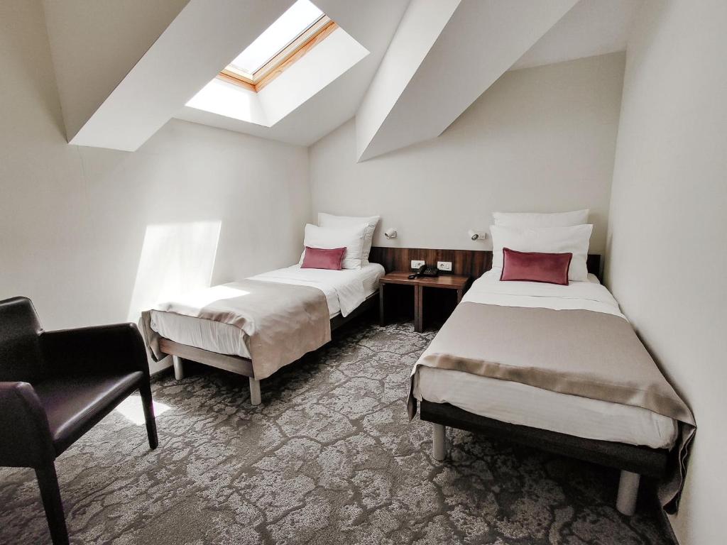 Postel nebo postele na pokoji v ubytování Hotel Pine