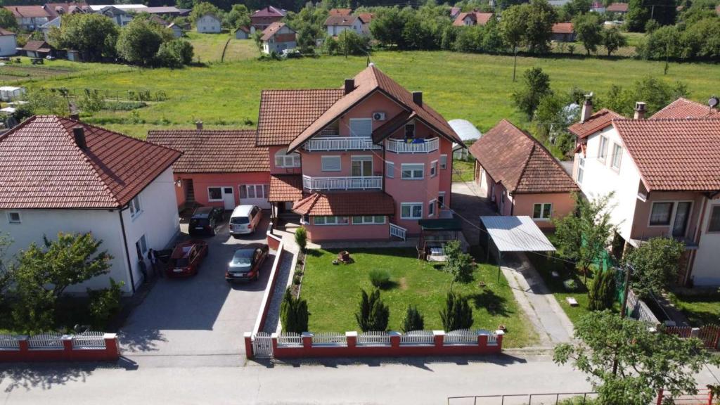 an aerial view of a house in a residential neighborhood at Apartments Alibasic in Dubrave Gornje