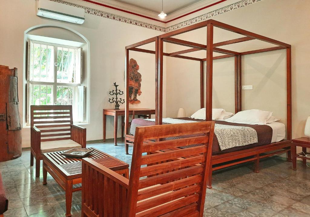 Postel nebo postele na pokoji v ubytování Saratha Vilas Chettinad