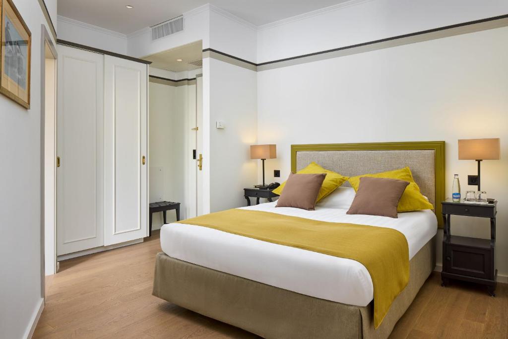 Postel nebo postele na pokoji v ubytování Hotel Victoria