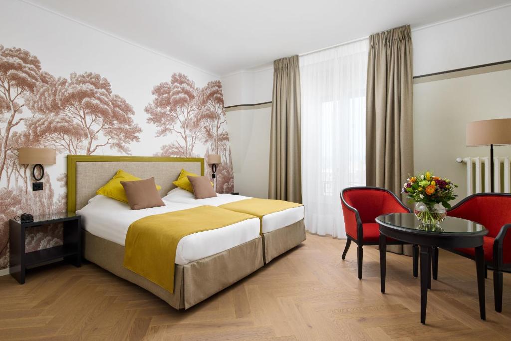 Postel nebo postele na pokoji v ubytování Hotel Victoria