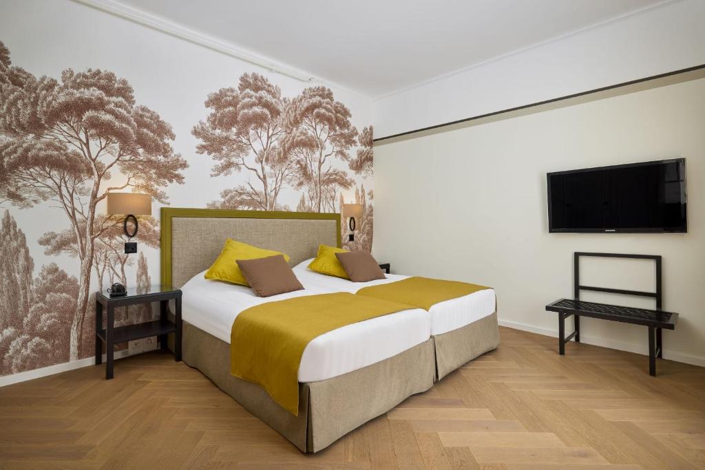 Postel nebo postele na pokoji v ubytování Hotel Victoria