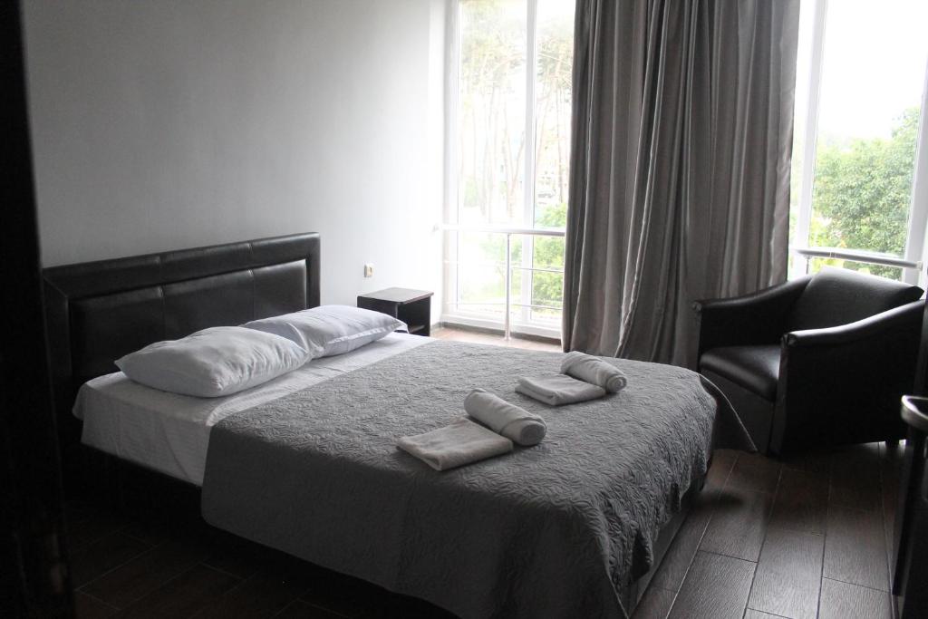 Postel nebo postele na pokoji v ubytování Hotel Orbita Ureki
