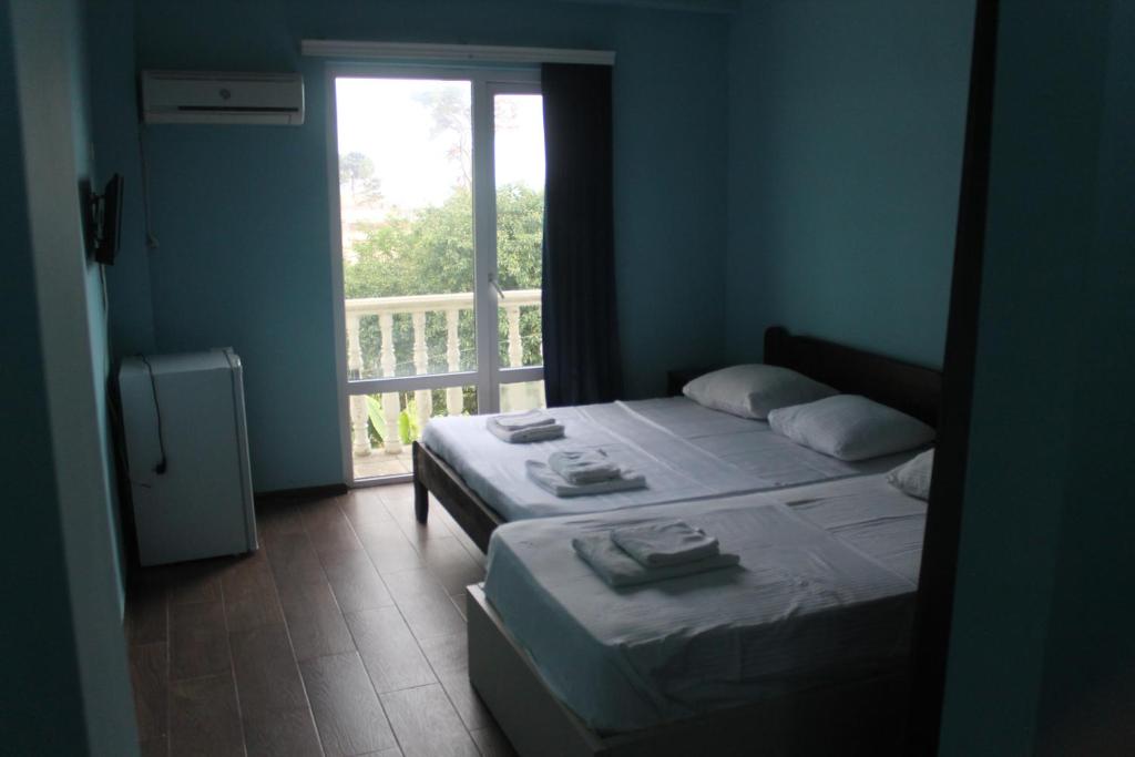 Postel nebo postele na pokoji v ubytování Hotel Orbita Ureki