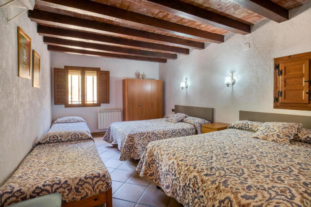 Postel nebo postele na pokoji v ubytování La Vinya Pineda de Mar