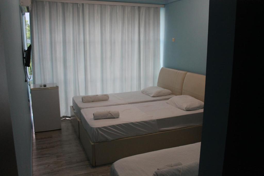 Postel nebo postele na pokoji v ubytování Hotel Orbita Ureki