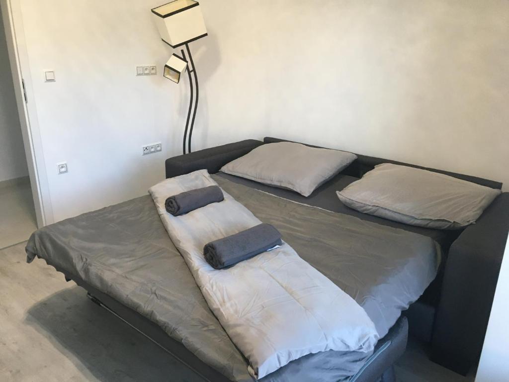 Postel nebo postele na pokoji v ubytování Apartmány Dimitra 2