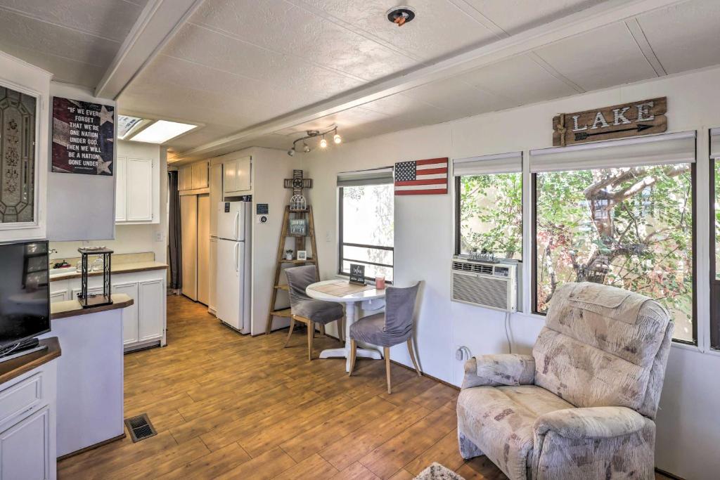 a kitchen and living room with a couch and a table at Lake Havasu City Home with Private Beach, Dock! in Lake Havasu City