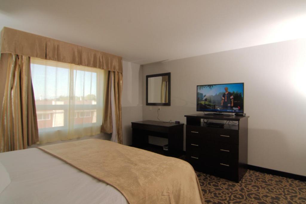 TV a/nebo společenská místnost v ubytování Paradise Inn and Suites Redwater
