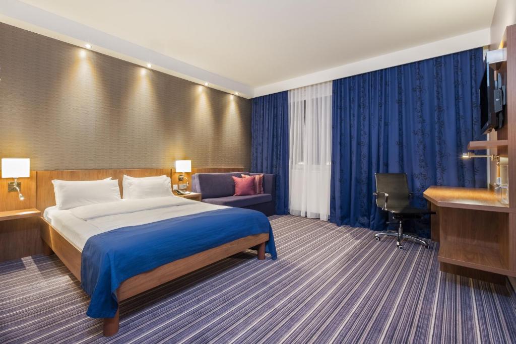 Postel nebo postele na pokoji v ubytování Holiday Inn Express Friedrichshafen by IHG