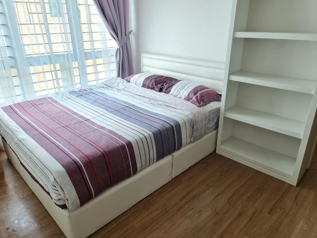 Postel nebo postele na pokoji v ubytování Pearl Residences Sleep 27