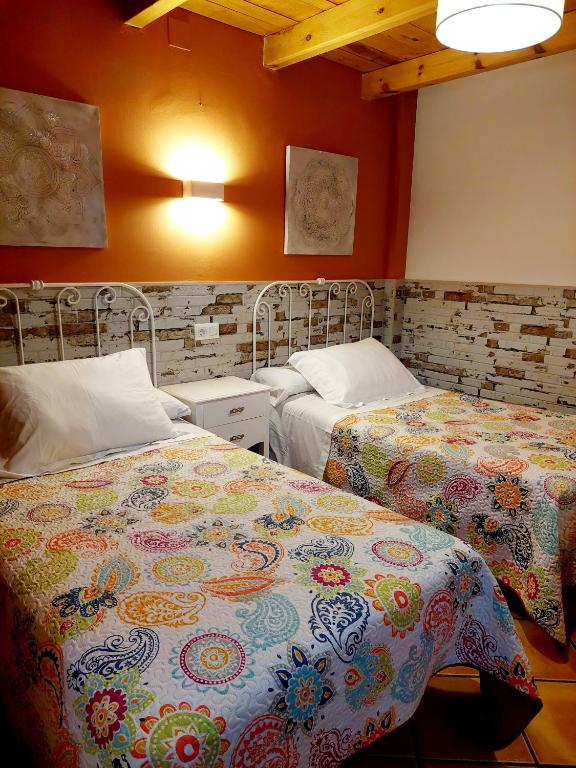 Postel nebo postele na pokoji v ubytování Casa Arroyo Los Ubios Arroyo Frio
