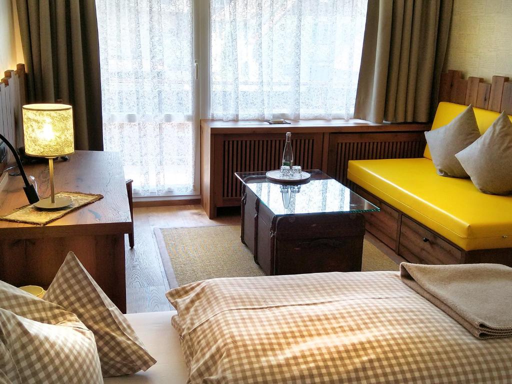 Postel nebo postele na pokoji v ubytování Schwarzwaldhotel Klumpp