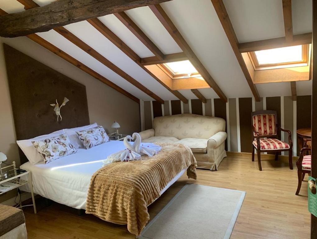 Un pat sau paturi într-o cameră la Posada Cicero