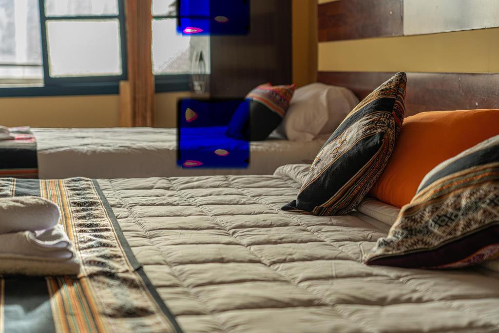 Postel nebo postele na pokoji v ubytování Rituales Inn Cusco - San Blas