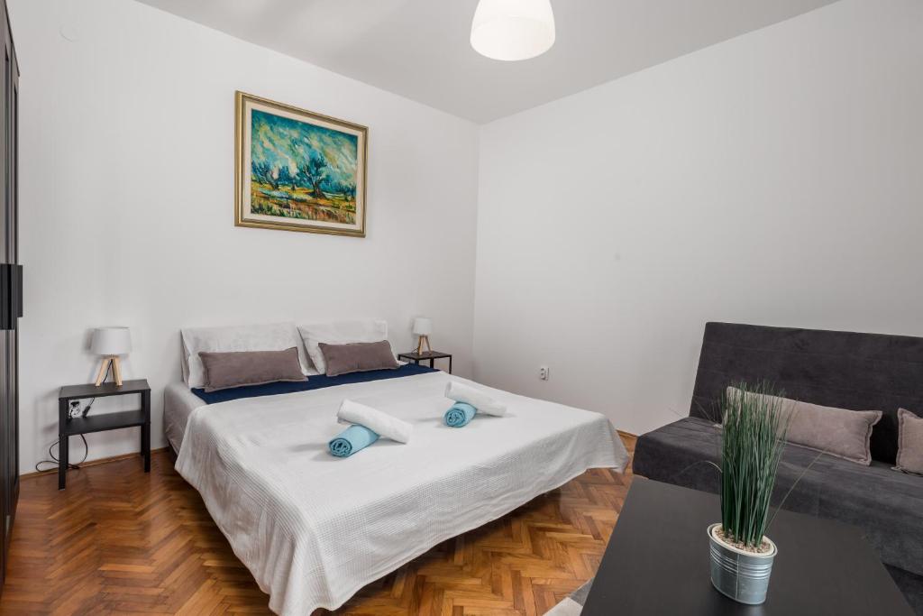 Postel nebo postele na pokoji v ubytování Apartment La Perla