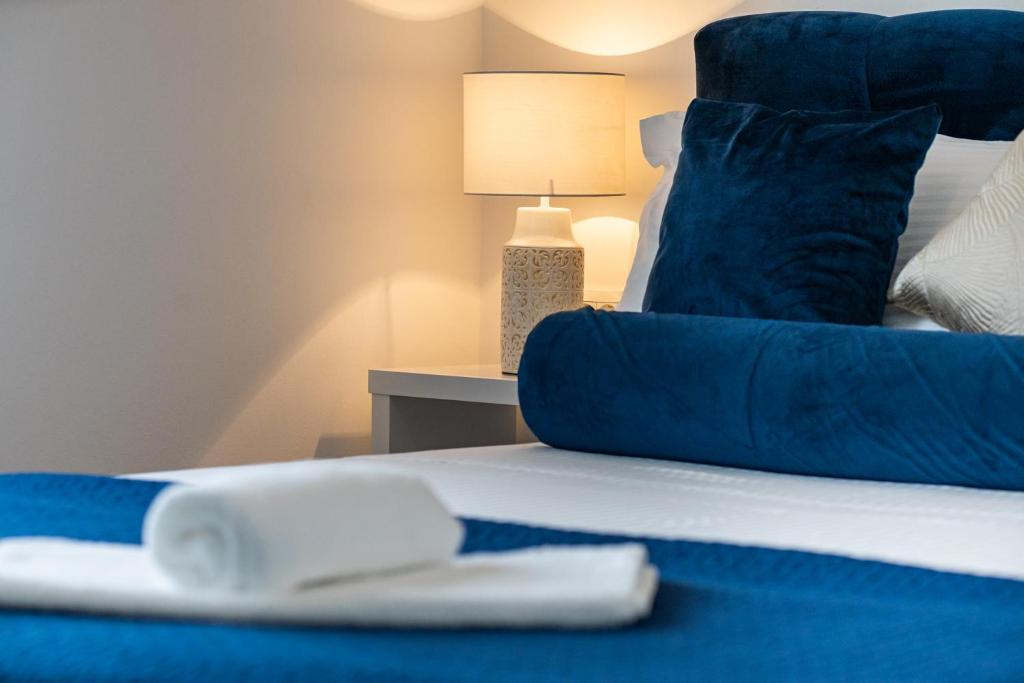 Postel nebo postele na pokoji v ubytování Oliva Vallis Apartments