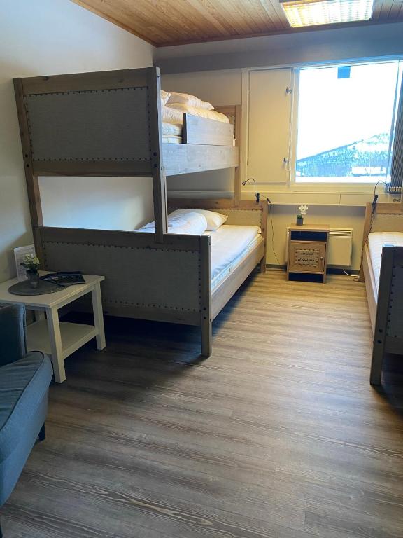 Postel nebo postele na pokoji v ubytování Basecamp Frich`s Hjerkinn