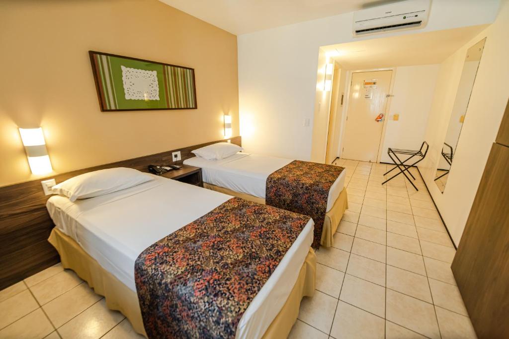 Postel nebo postele na pokoji v ubytování Hotel Sonata de Iracema