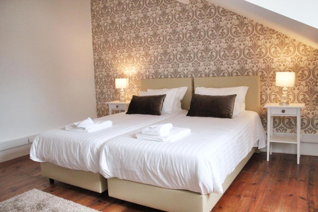 Postel nebo postele na pokoji v ubytování The Sky Lofts Lisbon - Guesthouse