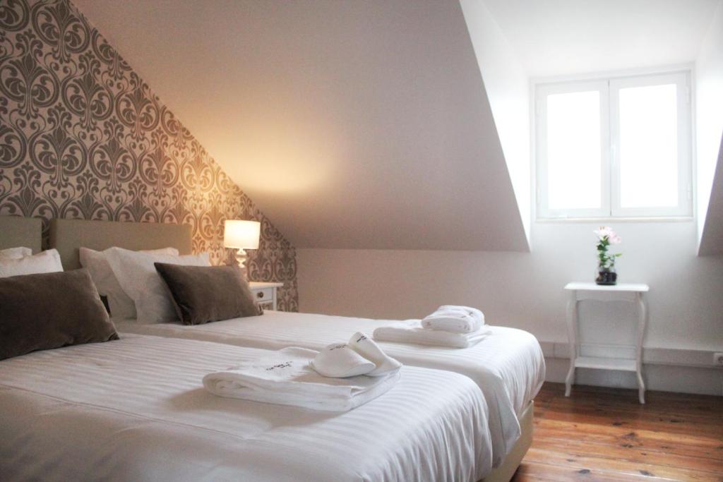 Postel nebo postele na pokoji v ubytování The Sky Lofts Lisbon - Guesthouse