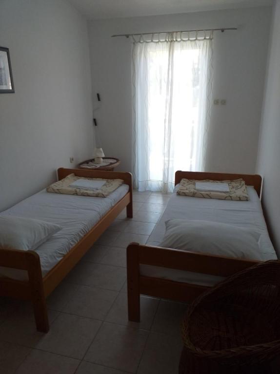 Postel nebo postele na pokoji v ubytování Apartments Jakov