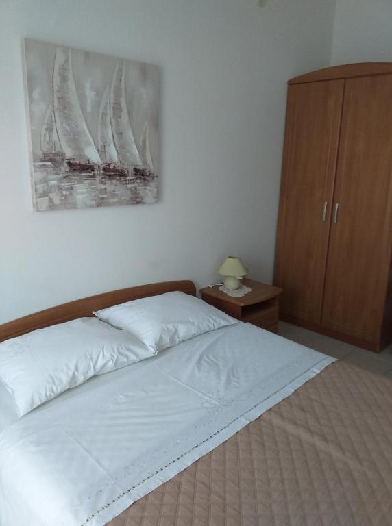 Postel nebo postele na pokoji v ubytování Apartments Jakov