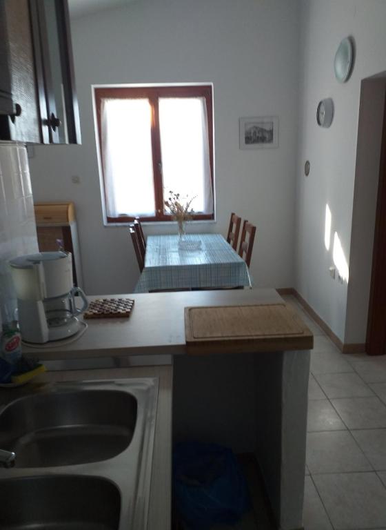 Kuchyň nebo kuchyňský kout v ubytování Apartments Jakov