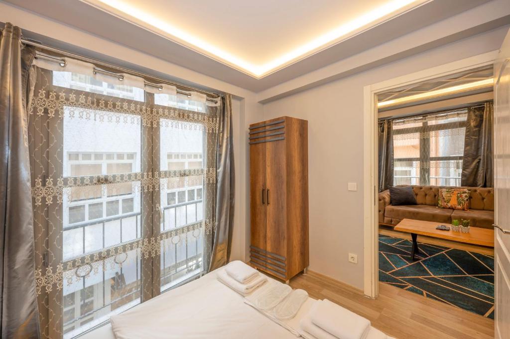 A bed or beds in a room at Dorne Suite Taksim Hotel