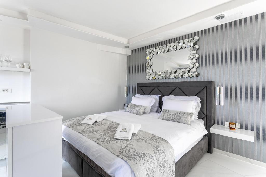 Postel nebo postele na pokoji v ubytování Vidikovac Levanda Luxury Apartments