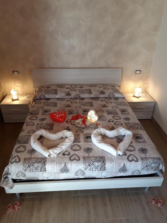 Postel nebo postele na pokoji v ubytování B&B GLI ULIVI