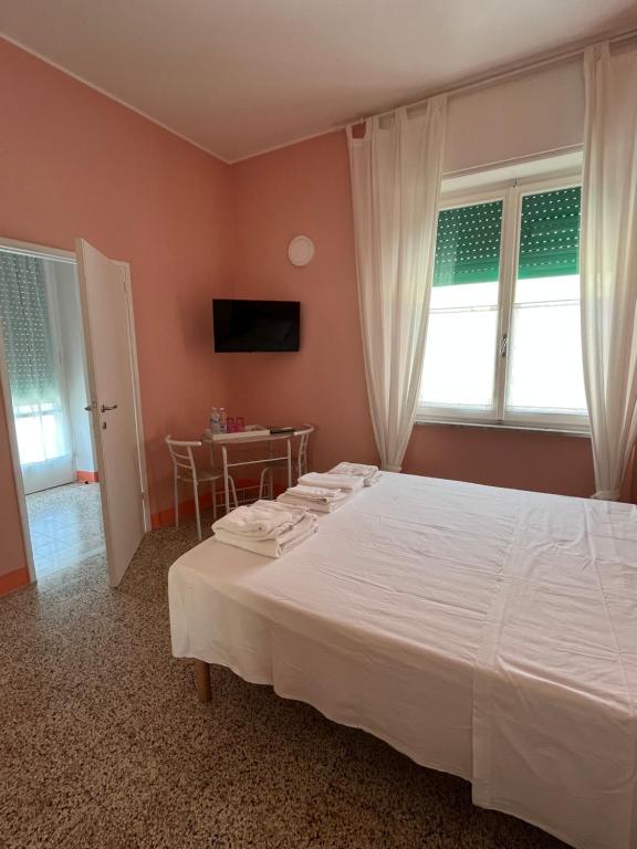 Postel nebo postele na pokoji v ubytování Bed and coffee Rooms Portoferraio