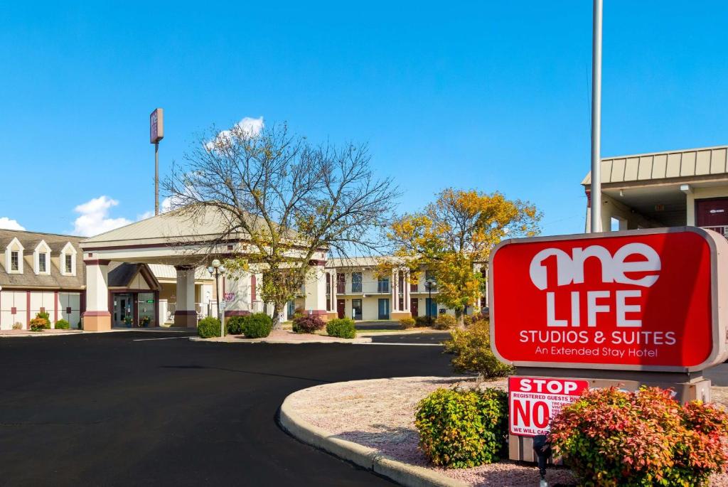 a mez life sign in front of a store at One life studio and suites in Evansville