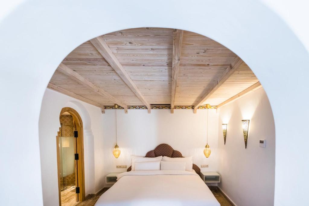 Postel nebo postele na pokoji v ubytování Dar Echchaouen Maison d'Hôtes & Riad
