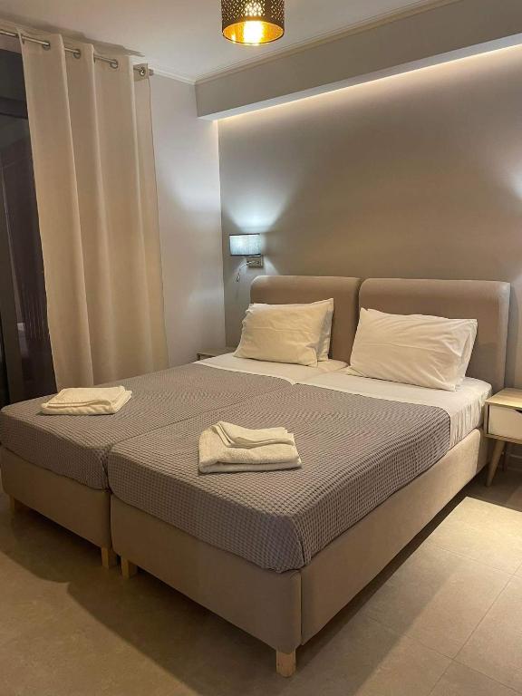 Łóżko lub łóżka w pokoju w obiekcie Iris Villas Complex