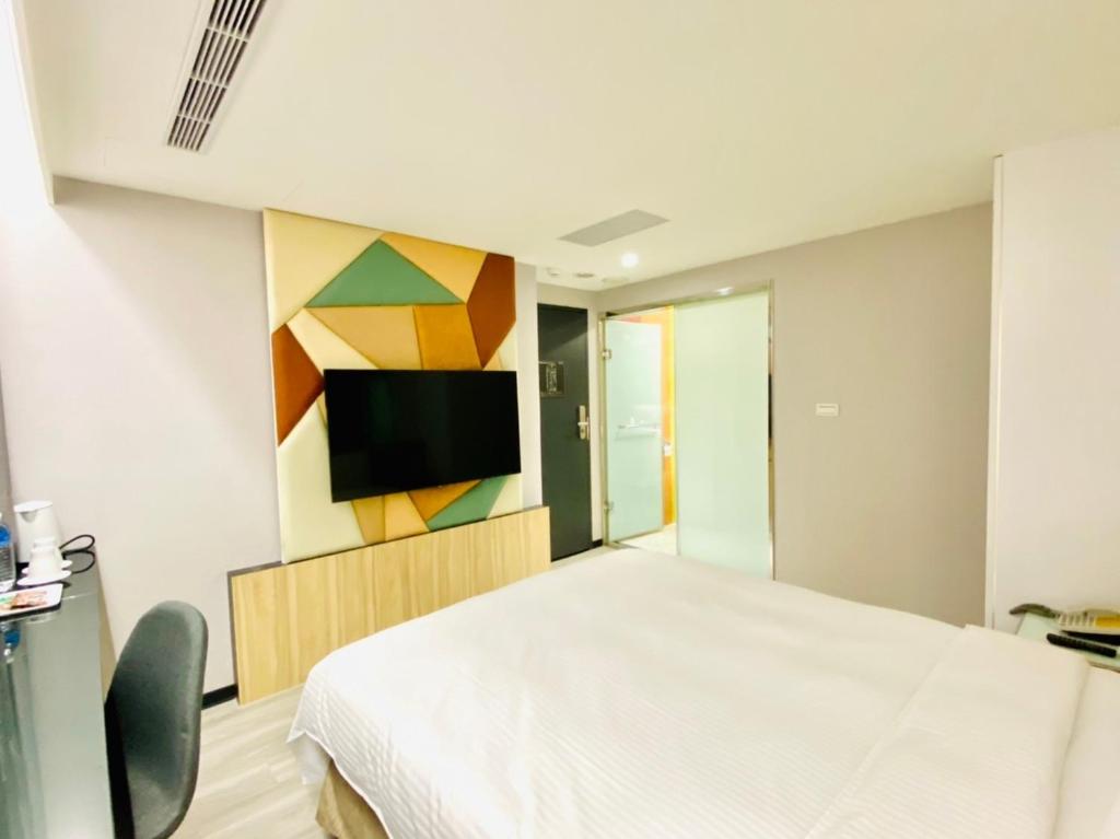 TV a/nebo společenská místnost v ubytování Hub Hotel Ximen Inn