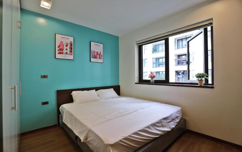 Ένα ή περισσότερα κρεβάτια σε δωμάτιο στο LUCK APART 05 - Tay Ho Hanoi Apartment