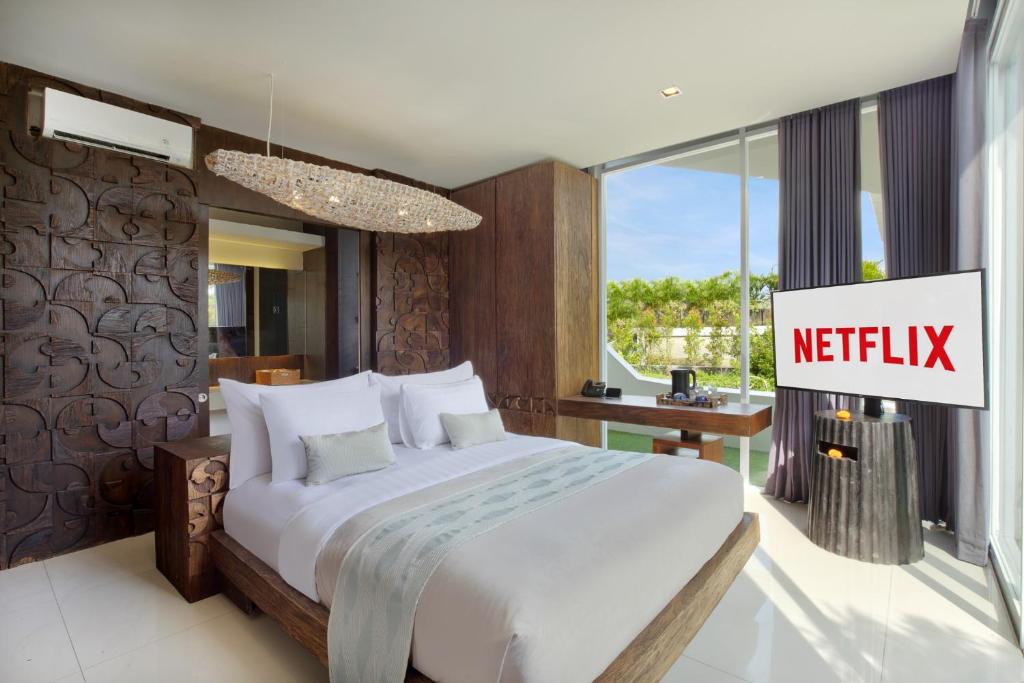 Postel nebo postele na pokoji v ubytování Monolocale Luxury Resort & Spa Seminyak by Ini Vie Hospitality