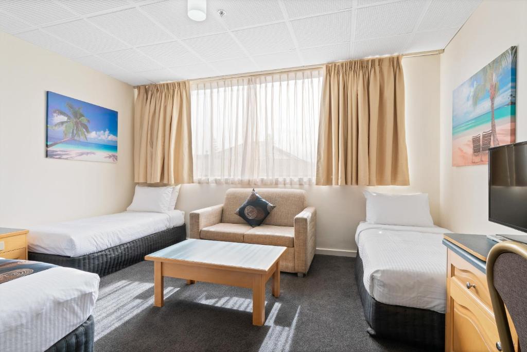 Postel nebo postele na pokoji v ubytování Adelaide International Motel