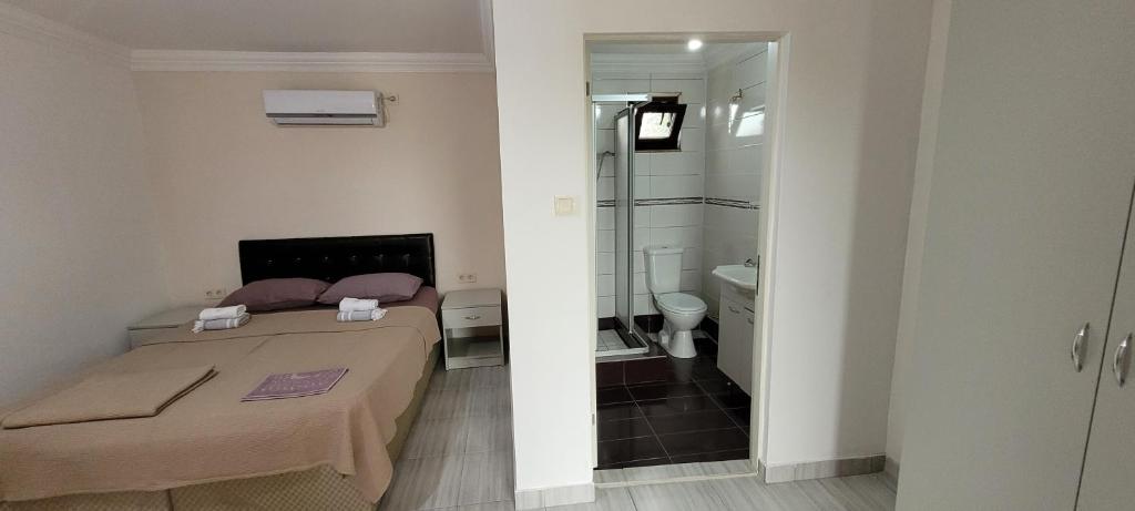 Postel nebo postele na pokoji v ubytování Apsa Butik Hotel