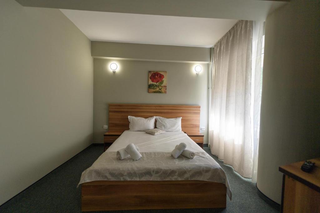 Postel nebo postele na pokoji v ubytování Hotel Cora