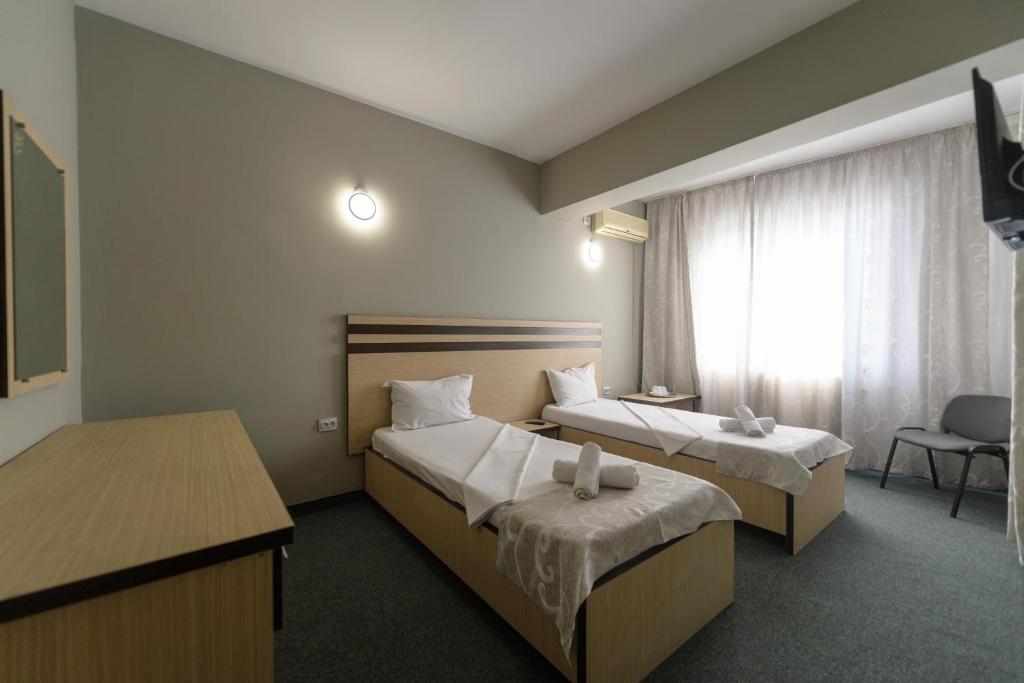 Postel nebo postele na pokoji v ubytování Hotel Cora